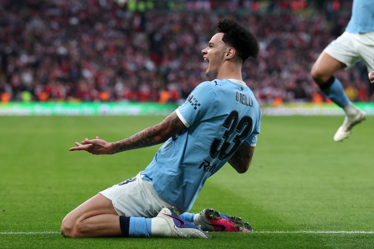 Manchester City's Nico O'Reilly celebrates after scoring the opening goal during the English League Cup final soccer match between Arsenal and Manchester City in London, Sunday, March 22, 2026. (AP Photo/Richard Pelham)