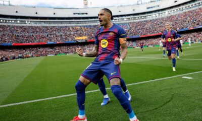 Barcelona's Raphinha celebrates after scoring his side's opening goal during the Spanish La Liga soccer match between Barcelona and Sevilla in Barcelona, Spain, Sunday, March 15, 2026. (AP Photo/Joan Monfort)