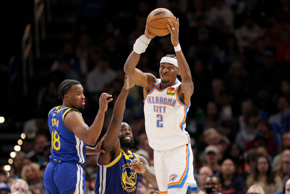 Oklahoma City Thunder guard Shai Gilgeous-Alexander (2) looks to pass the ball away from Golden State Warriors forward Draymond Green (23) and guard LJ Cryer (18) during the second half of an NBA basketball game Saturday, March 7, 2026, in Oklahoma City. (AP Photo/Nate Billings)