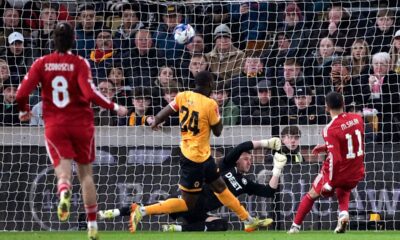Liverpool's Mohamed Salah, right, scores their second goal of the game during an English FA Cup fifth round match against Wolverhampton Wanderers, Friday, March 6, 2026, in Wolverhampton, England. (Peter Byrne/PA via AP)
