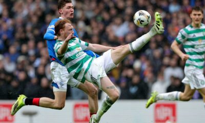 Ranger's Ryan Naderi, left, and Celtic's Liam Scales, right, challenge for the ball during the Scotish Premiership match between Glasgow Rangers and Celtic Glasgow in Glasgow, Scotland, Sunday, March 1, 2026. (Steve Welsh/PA via AP)