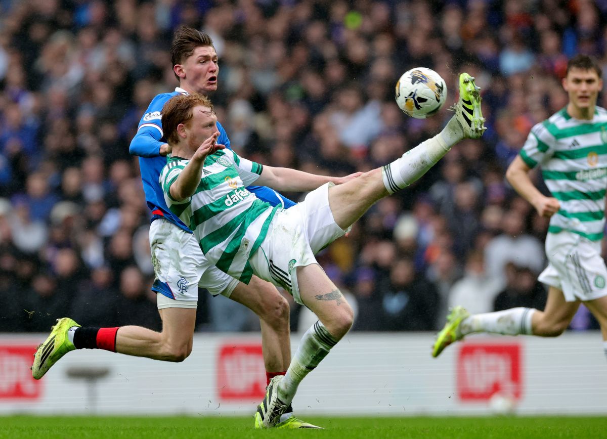 Ranger's Ryan Naderi, left, and Celtic's Liam Scales, right, challenge for the ball during the Scotish Premiership match between Glasgow Rangers and Celtic Glasgow in Glasgow, Scotland, Sunday, March 1, 2026. (Steve Welsh/PA via AP)