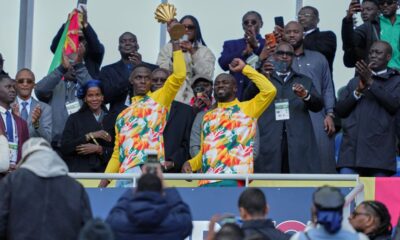 enegal players celebrate with the Africa Cup of Nations trophy ahead of the international friendly soccer match between Senegal and Peru in Saint-Denis, outside of Paris, Saturday, March 28, 2026. (AP Photo/Aurelien Morissard)