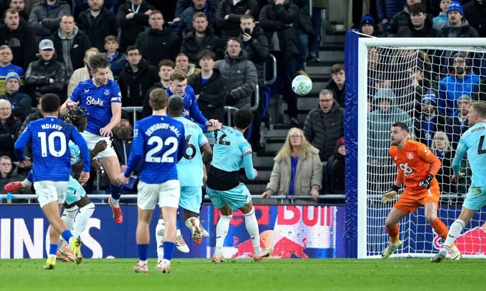 Everton's James Tarkowski, top left, scores their side's first goal of the game during their English Premier League soccer match against Burnley in Liverpool, England, Tuesday, March 3, 2026. (Peter Byrne/PA via AP)