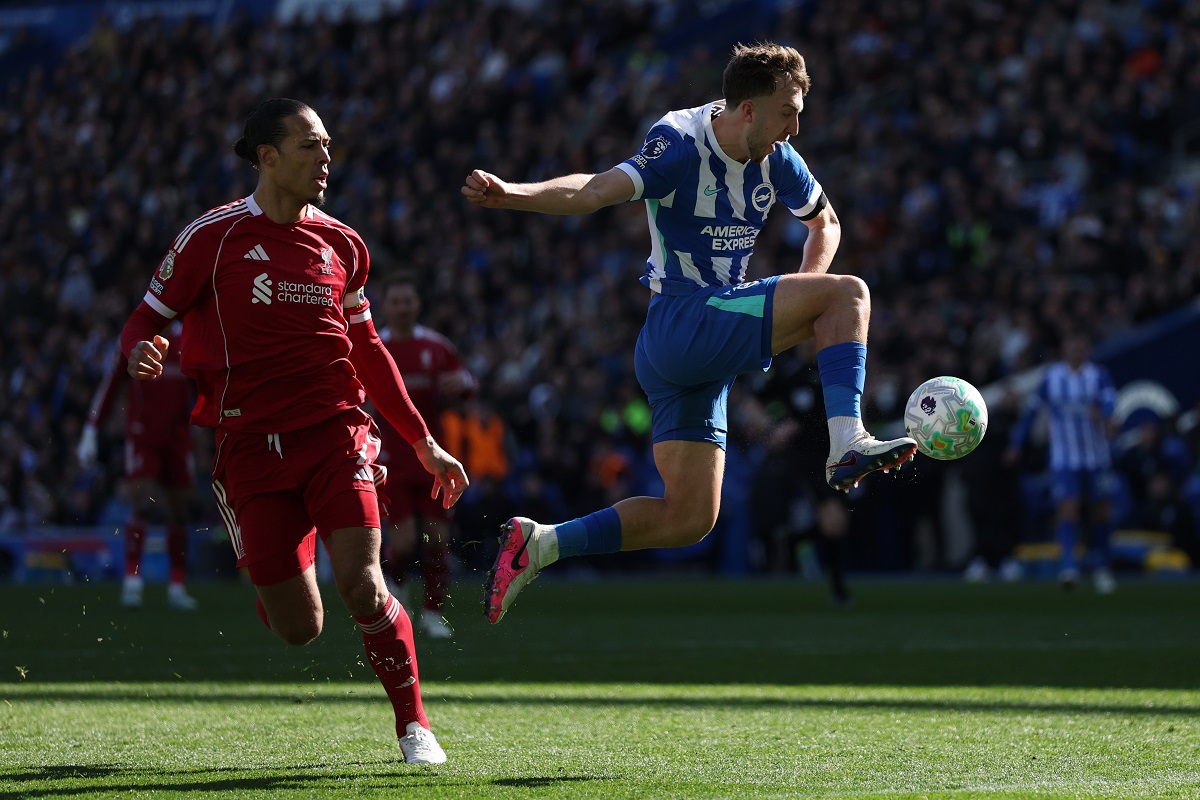 Brighton's Jack Hinshelwood passes the ball in front of Liverpool's Virgil van Dijk during the English Premier League soccer match between Brighton and Liverpool in Brighton, Saturday, March 21, 2026. (AP Photo/Ian Walton)