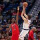 Los Angeles Clippers guard Bogdan Bogdanovic (7) shoots a jumper over New Orleans Pelicans center Yves Missi (21) in the second half of an NBA basketball game in New Orleans, Thursday, March 19, 2026. (AP Photo/Peter Forest)