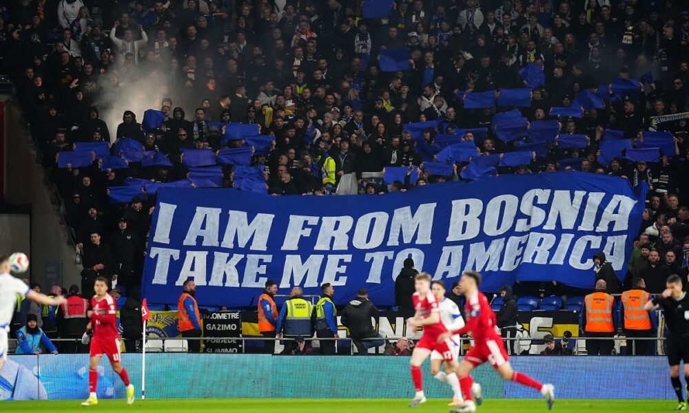 Bosnia and Herzegovina fans hold a banner in the stands during the World Cup playoff semifinal soccer match between Wales and Bosnia and Herzegovina in Cardiff, Wales, Thursday, March 26, 2026. (David Davies/PA via AP)