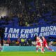 Bosnia and Herzegovina fans hold a banner in the stands during the World Cup playoff semifinal soccer match between Wales and Bosnia and Herzegovina in Cardiff, Wales, Thursday, March 26, 2026. (David Davies/PA via AP)