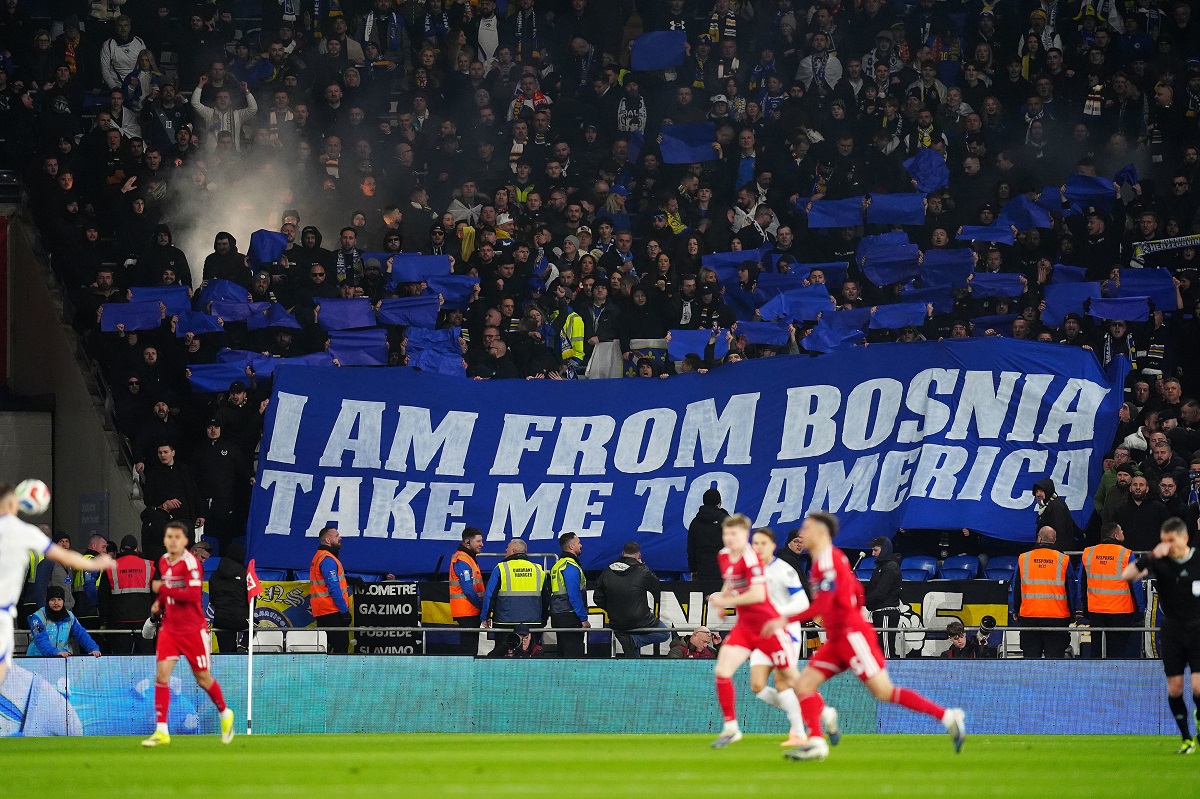 Bosnia and Herzegovina fans hold a banner in the stands during the World Cup playoff semifinal soccer match between Wales and Bosnia and Herzegovina in Cardiff, Wales, Thursday, March 26, 2026. (David Davies/PA via AP)