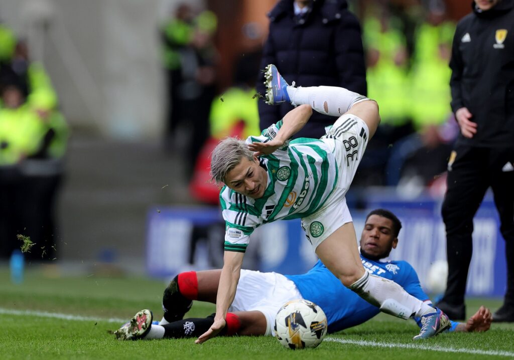 Celtic's Daizen Maeda, foreground is fouled by Rangers' Dujon Sterling during the Scottish Cup quarterfinal soccer match between Rangers and Celtic, in Glasgow, Scotland, Sunday March 8, 2026. (Steve Welsh/PA via AP)