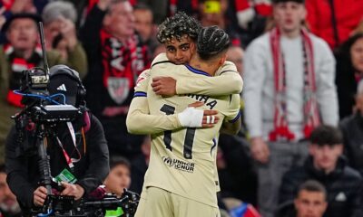 Barcelona's Lamine Yamal, back, is congratulated after scoring his side's opening goal during the Spanish La Liga soccer match between Athletic Bilbao and Barcelona in Bilbao, Spain, Saturday, March 7, 2026. (AP Photo/Miguel Oses)