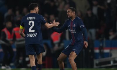 PSG's Bradley Barcola, right, is congratulated by Achraf Hakimi after scoring his side's first goal during the French League One soccer match between Paris Saint-Germain and Monaco in Paris, Friday, March 6, 2026. (AP Photo/Thibault Camus)