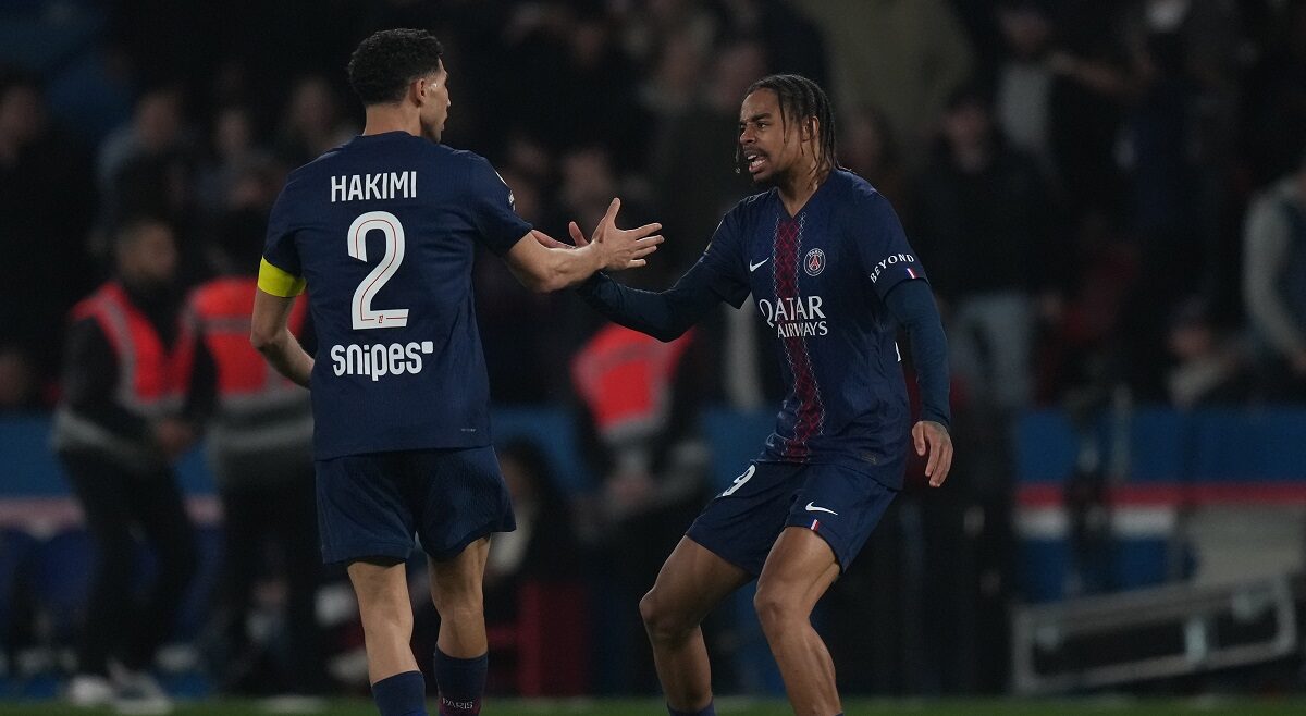 PSG's Bradley Barcola, right, is congratulated by Achraf Hakimi after scoring his side's first goal during the French League One soccer match between Paris Saint-Germain and Monaco in Paris, Friday, March 6, 2026. (AP Photo/Thibault Camus)