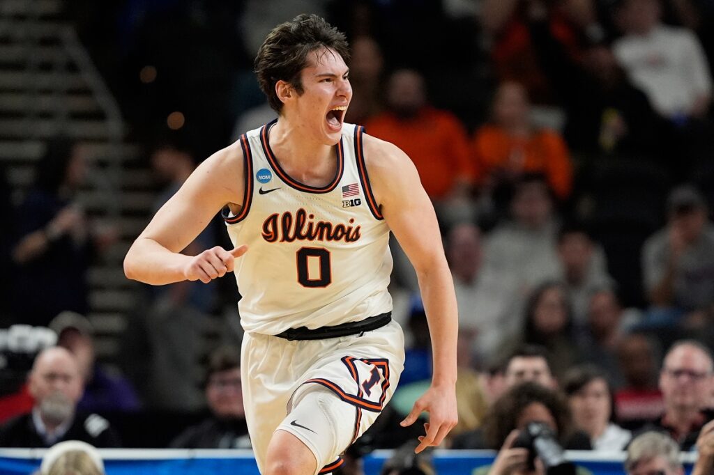 Illinois forward David Mirkovic celebrates after scoring against Pennsylvania during the first half in the first round of the NCAA college basketball tournament, Thursday, March 19, 2026, in Greenville, S.C. (AP Photo/Chris Carlson)