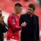 Manchester United's Benjamin Sesko shakes hands with coach Michael Carrick after the Premiier League soccer match between Manchester United and Crystal Palace in Manchester, England, Sunday, March 1, 2026. (AP Photo/Dave Thompson)