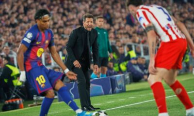 Atletico Madrid's head coach Diego Simeone, centre, reacts during the Champions League quarterfinal first leg soccer match between Barcelona and Atletico Madrid in Barcelona, Spain, Wednesday, April 8, 2026. (AP Photo/Joan Monfort)