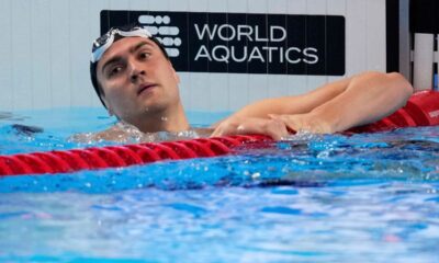 FILE - Neutral Athlete Russia, Kliment Kolesnikov reacts after winning gold medal in the men's 50-meter backstroke final at the World Aquatics Championships in Singapore, on Aug. 3, 2025. (AP Photo/Vincent Thian, File)