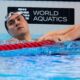 FILE - Neutral Athlete Russia, Kliment Kolesnikov reacts after winning gold medal in the men's 50-meter backstroke final at the World Aquatics Championships in Singapore, on Aug. 3, 2025. (AP Photo/Vincent Thian, File)