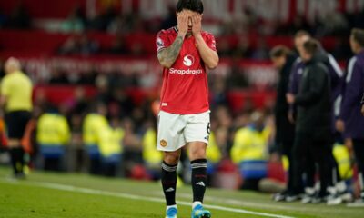 Manchester United's Lisandro Martinez reacts after receiveng a red card during the Premiier League soccer match between Manchester United and Leeds in Manchester, England, Monday, April 13, 2026. (AP Photo/Dave Thompson)