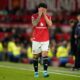 Manchester United's Lisandro Martinez reacts after receiveng a red card during the Premiier League soccer match between Manchester United and Leeds in Manchester, England, Monday, April 13, 2026. (AP Photo/Dave Thompson)