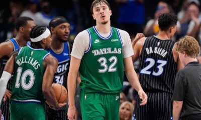Dallas Mavericks' Cooper Flagg looks down court after sinking a basket for his 50th point of the night late in the second half of an NBA basketball game against the Orlando Magic Friday, April 3, 2026, in Dallas. (AP Photo/Tony Gutierrez)