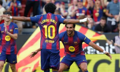 Barcelona's Ferran Torres, right, celebrates after scoring the opening goal with Barcelona's Lamine Yamal during the Spanish La Liga soccer match between Barcelona and Espanyol in Barcelona, Spain, Saturday, April 11, 2026. (AP Photo/Joan Monfort)