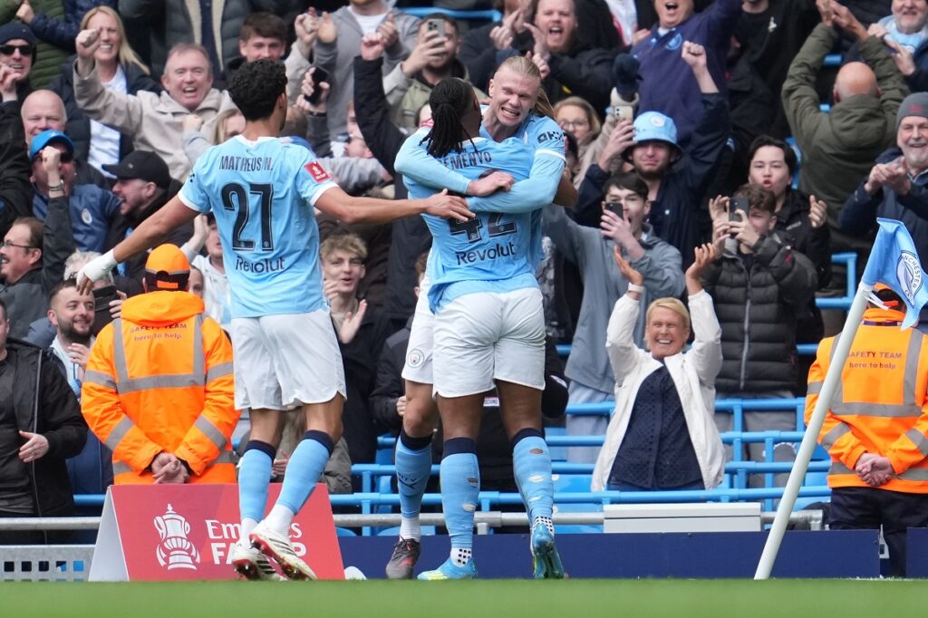 Manchester Cit players celebrate after a goal during the FA Cup quarter-final soccer match between Manchester City and Liverpool in Manchester, England, Saturday, April 4, 2026. (AP Photo/Jon Super)