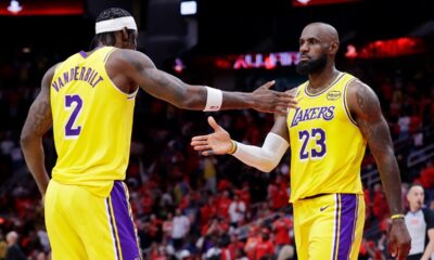 Los Angeles Lakers forwards Jarred Vanderbilt (2) and LeBron James (23) celebrate after their overtime win against the Houston Rockets in Game 3 of a first-round NBA playoffs basketball series Friday April 24, 2026, in Houston. (AP Photo/Michael Wyke)