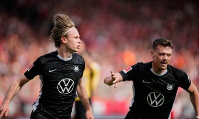 Wolfsburg's Patrick Wimmer celebrates his side's opening goal during the German Bundesliga soccer match between FC Union Berlin and Wolfsburg in Berlin, Germany, Saturday, April 18, 2026. (AP Photo/Ebrahim Noroozi)