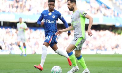 Chelsea's Estevao guards Manchester City's Bernardo Silva during the Premier League soccer match between Chelsea and Manchester City in London, Sunday, April 12, 2026. (AP Photo/Ian Walton)