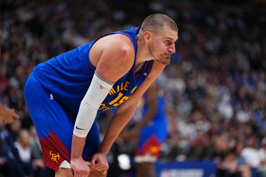 Denver Nuggets center Nikola Jokic reacts to a foul during the second half in Game 2 of a first-round NBA playoffs basketball series against the Minnesota Timberwolves Monday, April 20, 2026, in Denver. (AP Photo/Jack Dempsey)