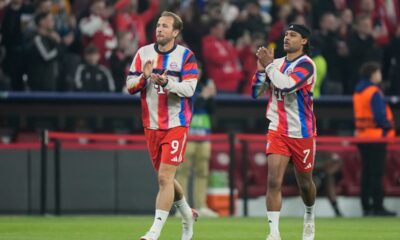 Bayern's Harry Kane, left, reacts with his teammate Serge Gnabry prior to the start of the Champions League quarterfinal second leg soccer match between Bayern Munich and Real Madrid in Munich, Germany, Wednesday, April 15, 2026. (AP Photo/Matthias Schrader)
