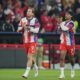 Bayern's Harry Kane, left, reacts with his teammate Serge Gnabry prior to the start of the Champions League quarterfinal second leg soccer match between Bayern Munich and Real Madrid in Munich, Germany, Wednesday, April 15, 2026. (AP Photo/Matthias Schrader)