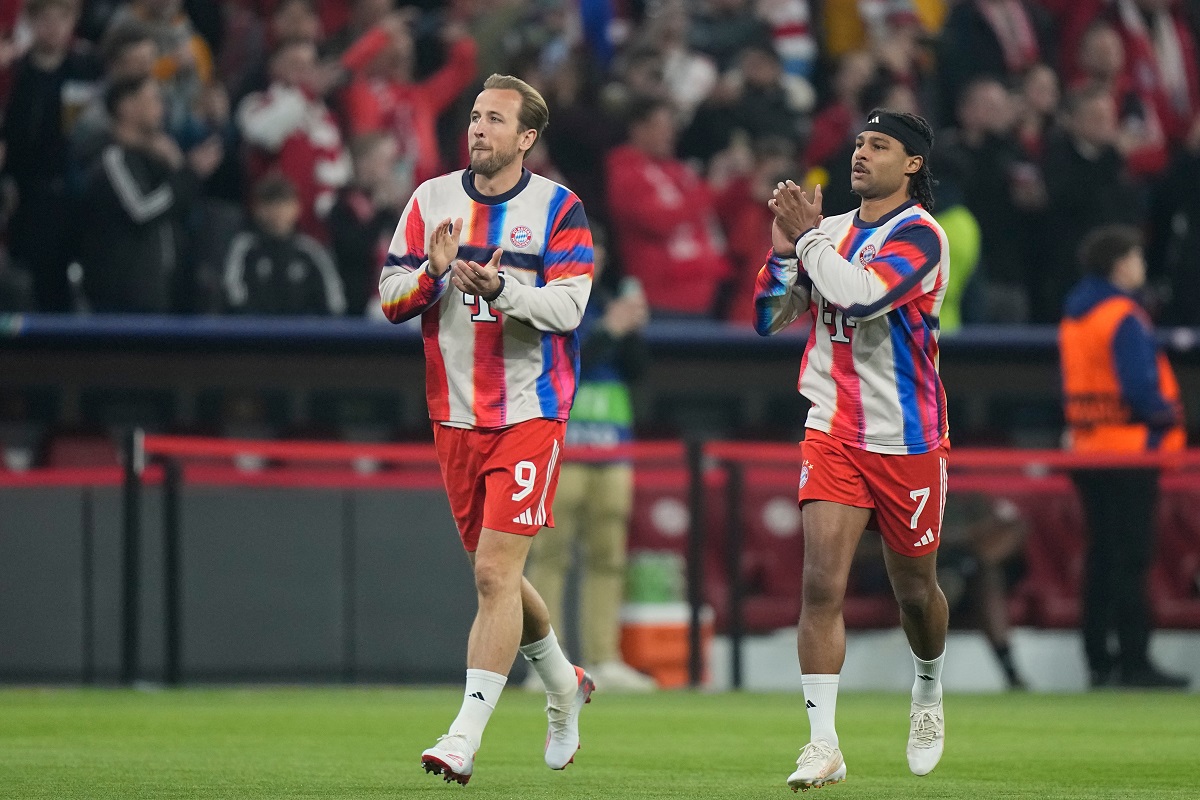 Bayern's Harry Kane, left, reacts with his teammate Serge Gnabry prior to the start of the Champions League quarterfinal second leg soccer match between Bayern Munich and Real Madrid in Munich, Germany, Wednesday, April 15, 2026. (AP Photo/Matthias Schrader)