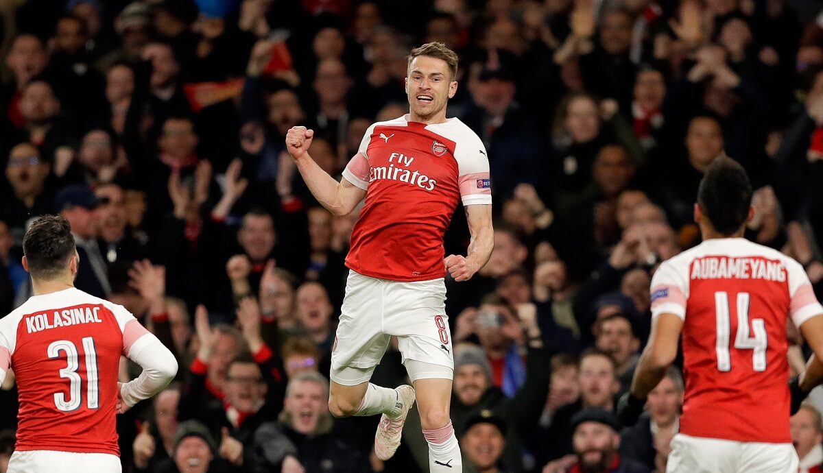 FILE - Arsenal's Aaron Ramsey, center, celebrates after scoring his side's first goal during the Europa League first leg quarterfinal soccer match between Arsenal and Napoli in London, on April 11, 2019. (AP Photo/Kirsty Wigglesworth, File)