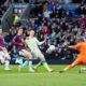 Manchester City's Erling Haaland, second right, scores his side's opening goal during the Premier League soccer match between Burnley and Manchester City in Burnley, England, Wednesday, April 22, 2026. (Nick Potts/PA via AP)