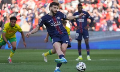 PSG's Khvicha Kvaratskhelia scores during the French League One soccer match between Paris Saint-Germain and Nantes in Paris, France, Wednesday, April 22, 2026. (AP Photo/Michel Euler)