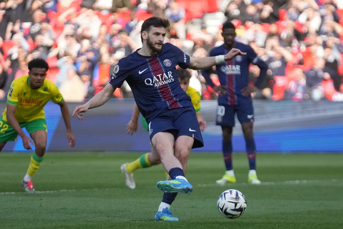 PSG's Khvicha Kvaratskhelia scores during the French League One soccer match between Paris Saint-Germain and Nantes in Paris, France, Wednesday, April 22, 2026. (AP Photo/Michel Euler)