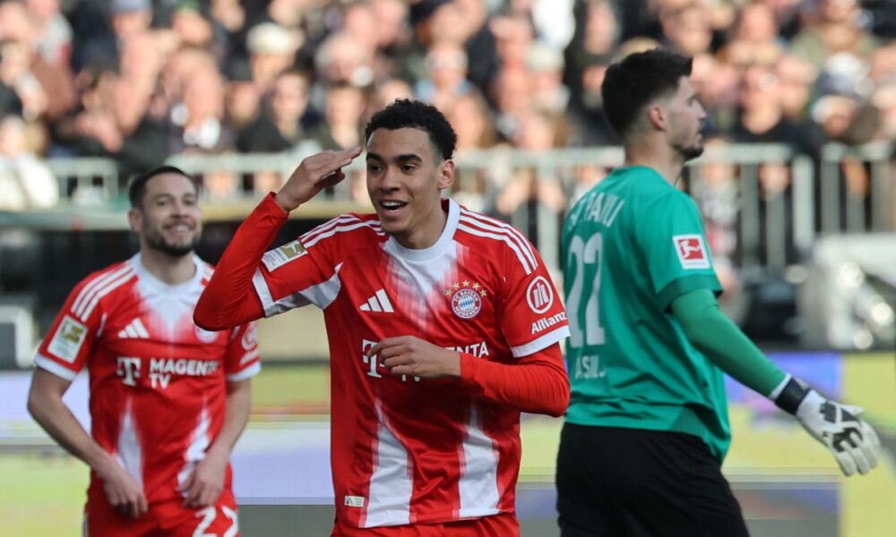 Bayern's Jamal Musiala celebrates after scoring during the German Bundesliga soccer match between FC St. Pauli and Bayern Munich in Hamburg, Germany, Saturday, April 11, 2026. (Christian Charisius/dpa via AP)