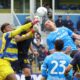 Parma goalkeeper Zion Suzuki punches the ball during the Serie A soccer match between Parma and Napoli, in Parma, Italy, Sunday, April 12, 2026. (Alberto Mariani/LaPresse via AP)