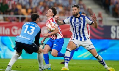 Real Sociedad's Duje Caleta-Car, right, and goalkeeper Unai Marrero, left, challenge for the ball with Atletico Madrid's Julian Alvarez during the Copa del Rey final soccer match between Atletico Madrid and Real Sociedad in Seville, Spain, Saturday, April. 18, 2026. (AP Photo/Jose Breton)