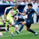 Dortmund's Maximilian Beier, left, and Hoffenheim's Ozan Kabak battle for the ball during their German Bundesliga soccer match in Sinsheim, Germany, Saturday, April 18, 2026. (Uwe Anspach/dpa via AP)