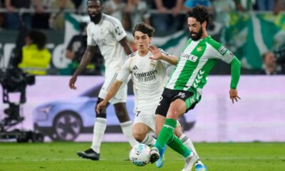 Betis' Isco passes the ball in front of Real Madrid's Manuel Ángel during a La Liga soccer match between Real Betis and Real Madrid in Seville, Spain, Friday, April 24, 2026. (AP Photo/Jose Breton)
