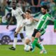 Betis' Isco passes the ball in front of Real Madrid's Manuel Ángel during a La Liga soccer match between Real Betis and Real Madrid in Seville, Spain, Friday, April 24, 2026. (AP Photo/Jose Breton)