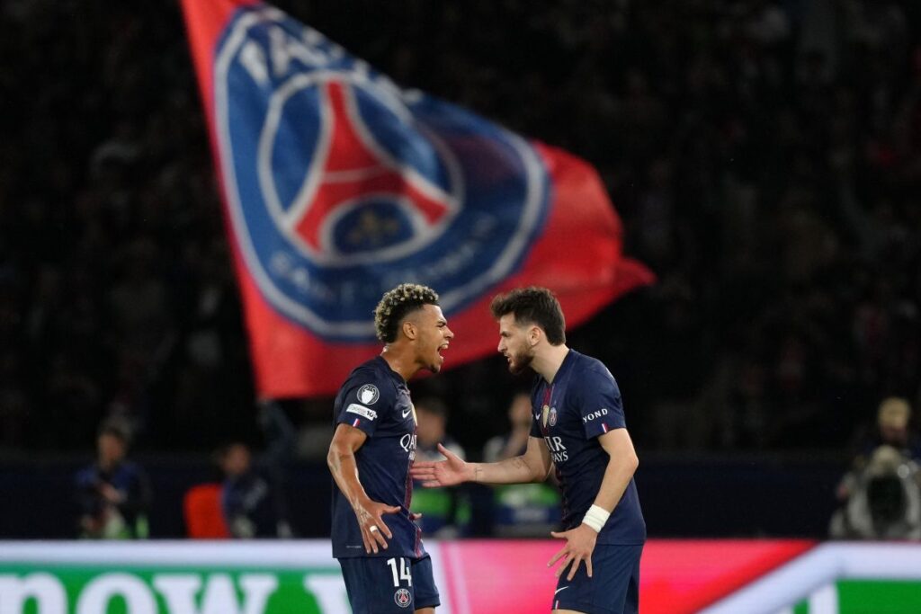 PSG's Khvicha Kvaratskhelia, right, celebrates with Desire Doue after scoring his side's first goal during a Champions League semifinal, first leg, soccer match between Paris Saint-Germain and Bayern Munich in Paris, Tuesday, April 28, 2026. (AP Photo/Aurelien Morissard)