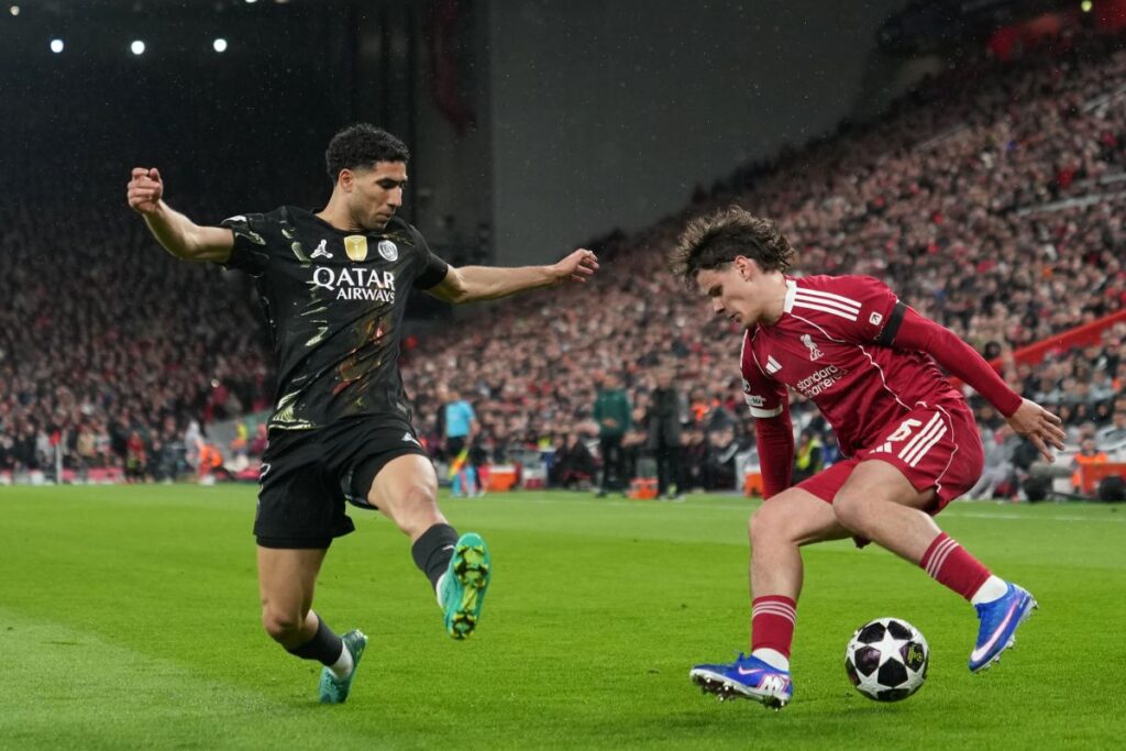 PSG's Achraf Hakimi guards Liverpool's Milos Kerkez during the Champions League quarterfinal second leg soccer match between Liverpool and Paris Saint-Germain in Liverpool, England, Tuesday, April 14, 2026. (AP Photo/Jon Super)