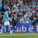 Lazio's Matteo Cancellieri, right, celebrates after scoring during the Italian Serie A soccer match between Napoli and Lazio in Naples, Italy, Saturday, April 18, 2026. (Alessandro Garofalo/LaPresse via AP)
