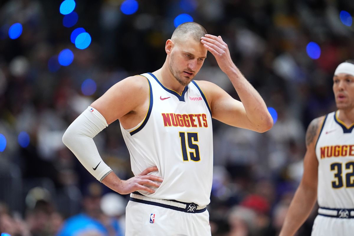 Denver Nuggets center Nikola Jokic waits for tip off in the first half in Game 1 of a first-round NBA playoffs basketball series against the Minnesota Timberwolves Saturday, April 18, 2026, in Denver. (AP Photo/David Zalubowski)