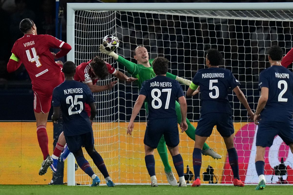 PSG's goalkeeper Matvey Safonov makes a save during the Champions League quarterfinal first leg soccer match between Paris Saint-Germain and Liverpool in Paris, Wednesday, April 8, 2026. (AP Photo/Thibault Camus)