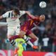 Atalanta's Giorgio Scalvini, left, and Roma's Donyell Malen battle for a header during an Italian Serie A soccer match between Roma and Atalanta, Saturday, April 18, 2026, in Rome. (Alfredo Falcone/LaPresse via AP)
